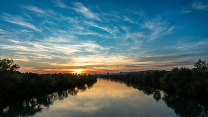 Naklejka na ściany i meble sunset over the river