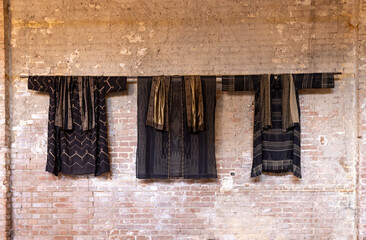 Old Egyptian clothing on a brick wall 