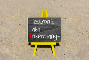 EDI electronic data interchange symbol. Concept words EDI electronic data interchange on blackboard. Beautiful sand background. Business and EDI electronic data interchange concept. Copy space.