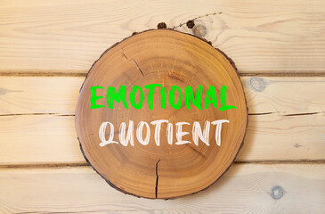 EQ emotional quotient symbol. Concept words EQ emotional quotient on beautiful wooden circle....
