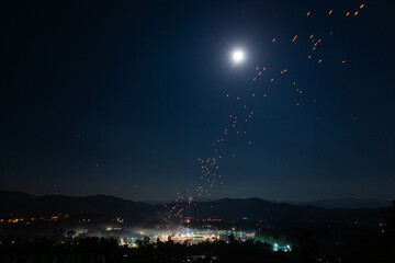 Sky Lanterns in night sky during Yee Peng festival. Doi Saket, Thailand.