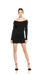 Summer Chic: Full-Length Portrait of a Young Woman Posing in a Short Dress and Sandals on White Background