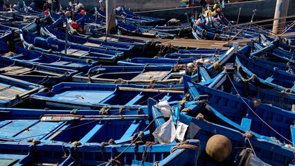 Fishing boats moored in the marina, at the port in Essaouira, Morocco - obrazy, fototapety, plakaty