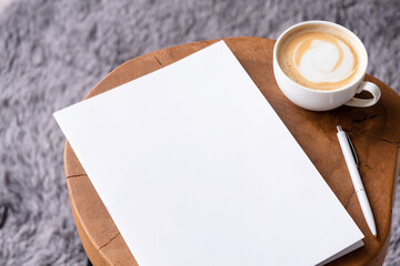 blank magazine mockup on coffee table with cappuccino, pen and grey rug