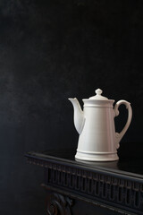 Still life with vintage white porcelain teapot