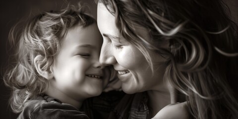 Fototapeta premium Monochrome portrait of joyful Caucasian mother and child in a loving embrace