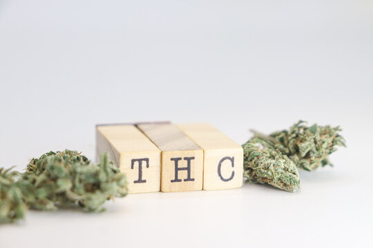 THC letters with cannabis buds around them