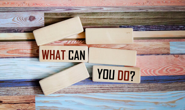 Wooden cubes with the inscription What can you do on a beautiful vintage background