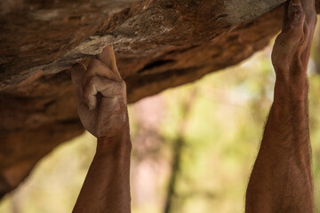Hands of a bouldering climber