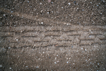 Tire track on dirt sand or mud,  grunge tone, drive on sand, off road