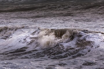 storm at sea, dramatic sky at sunset, big waves