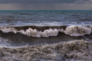 storm at sea, dramatic sky at sunset, big waves