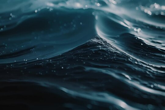 Deep blue ocean surface with small waves and droplets