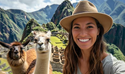 Fotobehang Positive beautiful woman tourist smiling and taking selfie with llamas at Machu Picchu. AI Generated © anatoliycherkas