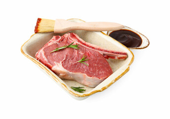 Raw meat, rosemary and brush with marinade isolated on white