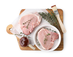 Board with raw meat, thyme, basting brush and marinade isolated on white, top view
