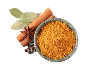 Dry curry powder in bowl and other spices isolated on white, top view