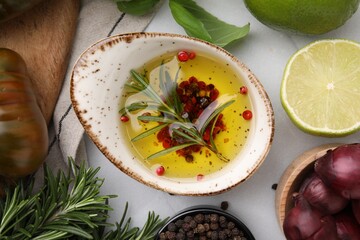 Tasty marinade and products on light table, flat lay