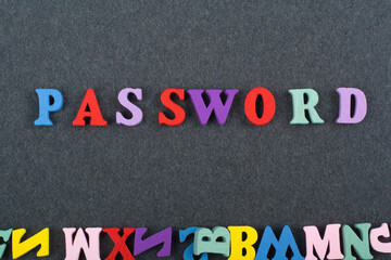 PASSWORD word on black board background composed from colorful abc alphabet block wooden letters, copy space for ad text. Learning english concept.