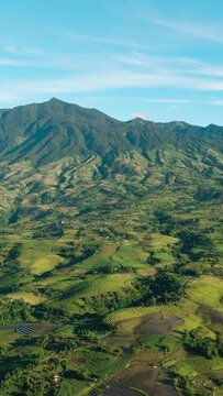Aerial drone of Canlaon volcano and farmland on the mountain slopes. Negros, Philippines
