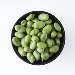 fresh greens broad beans fava on a white background