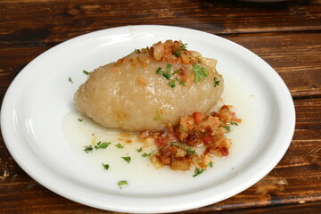 Table in a restaurant with a variety of
  snacks and food.