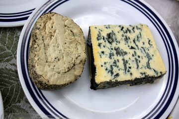 Table in a restaurant with a variety of
  snacks and food.