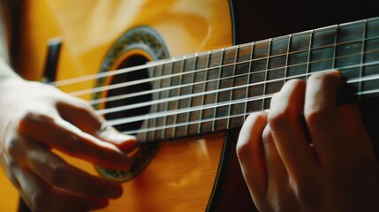 Obraz premium Close up of a person playing a guitar. Suitable for music-related designs