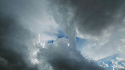 Storm clouds and hole with blue sky - 786585833
