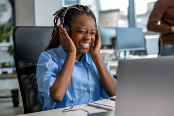 Cheerful woman call center operator having break during her work