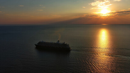 Naklejka na ściany i meble Cruise ship during sunset