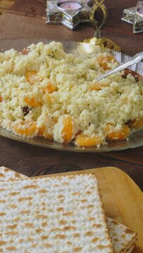 Matzo and menorah on the holiday table with traditional Passover Seder snacks