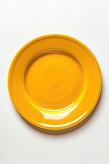 A yellow plate on a white surface. Perfect for food blogs