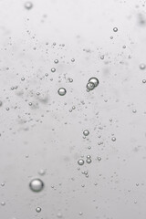 Bubbles in water on a white background. Closeup.