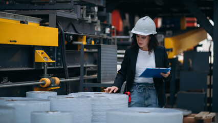 Industrial worker inspecting and check up machine at factory machines. Technician working in metal sheet at industry. Foreman checking Material or Machine.