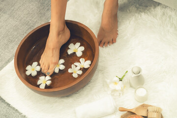 Panorama top view woman indulges in blissful foot massage at luxurious spa salon while masseur give...