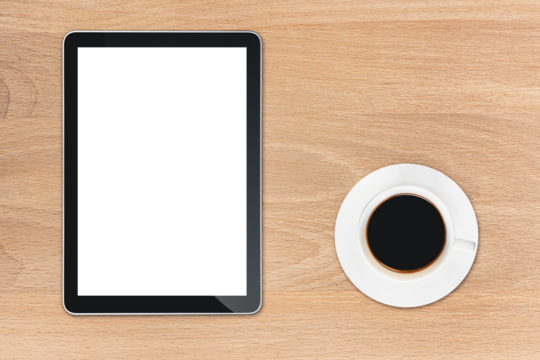 the tablet is on the wood table