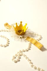 Toy crown and pearl necklace	