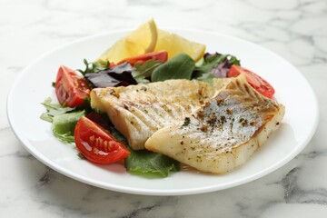 Tasty cod cooked served with salad on white marble table