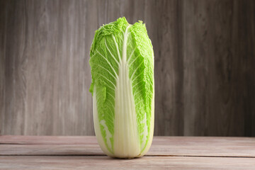 Fresh ripe Chinese cabbage on wooden table