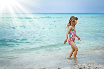 happy child playing on the sea nature