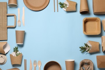 Frame of eco friendly food packagings and twigs on light blue background, flat lay. Space for text