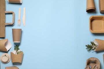 Flat lay composition with eco friendly food packagings and twigs on light blue background. Space...