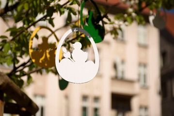 A flowering tree is decorated for Easter. Easter decor on European streets.   Zielona Gora, Poland, April.