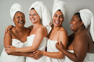 Group of multi generational women doing beauty day - Multiracial friends smiling in front of camera...