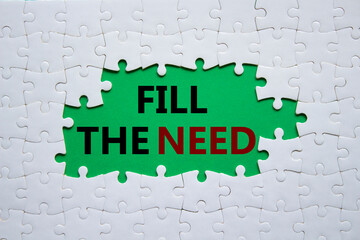 Fill the need symbol. Concept word Fill the need on white puzzle. Beautiful green background....