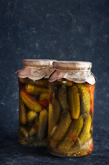 Preservation jars. Marinated cucumbers, homemade preparations. Vertical shot, Natural light