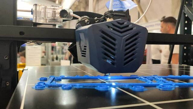 The process of printing an object on 3D printer from molten plastic. 3D printer printing model using molten plastic from extruder. 3D printing technology. New modern additive prototyping technologies