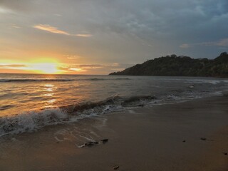 the sun sets with quite strong sea waves