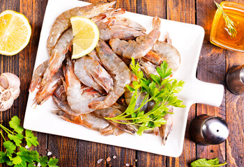 Uncooked Raw peeled tiger white shrimp prawn. wooden background. - 786634881